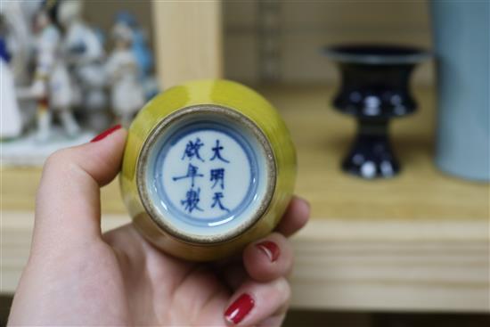 A Chinese blue-glazed stem cup, a yellow vase and a claire de lune glazed meiping